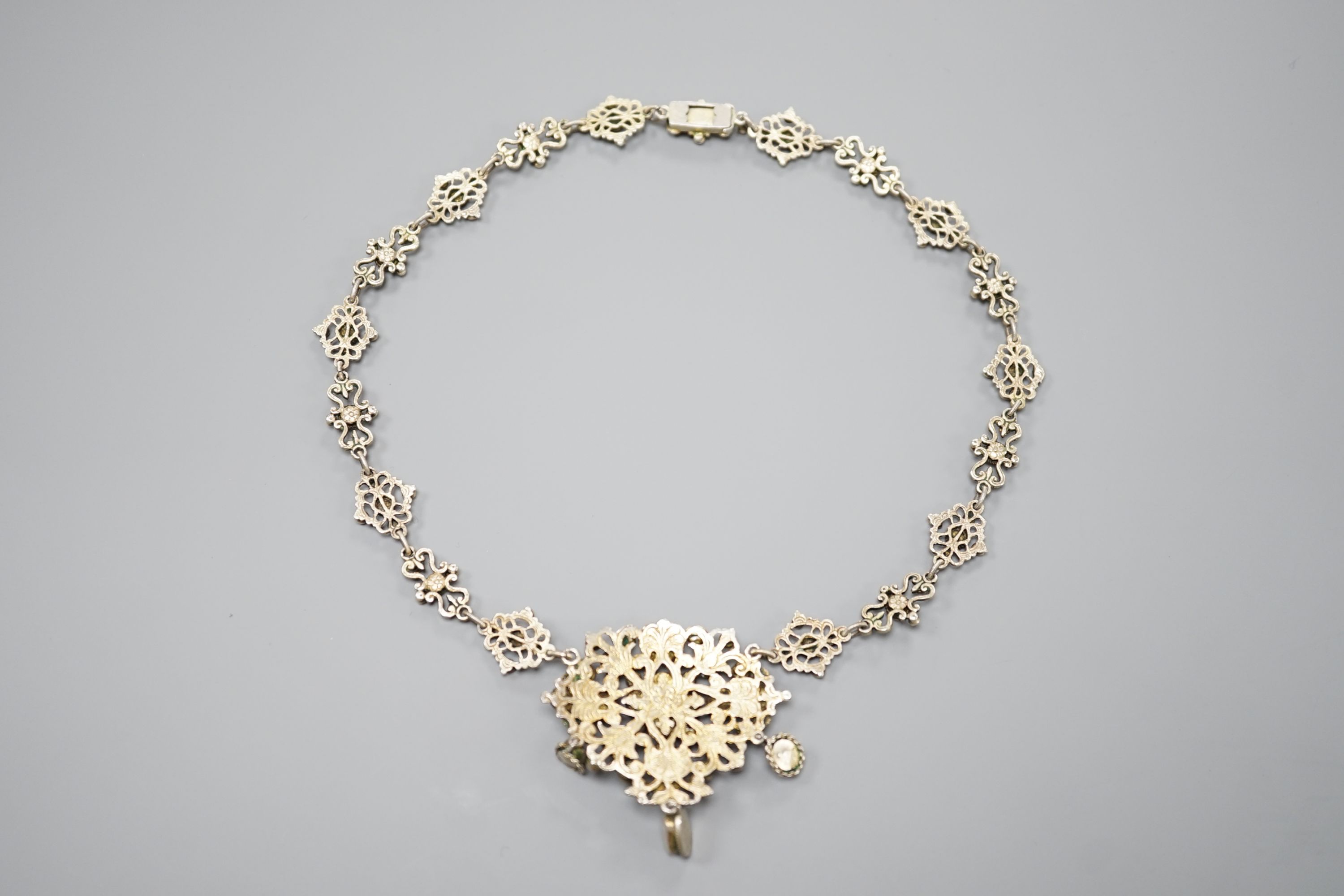 An ornate 19th century Austro-Hungarian gilt white metal, baroque pearl, paste and gem set drop necklace, 46cm, maker's mark WH or WM.